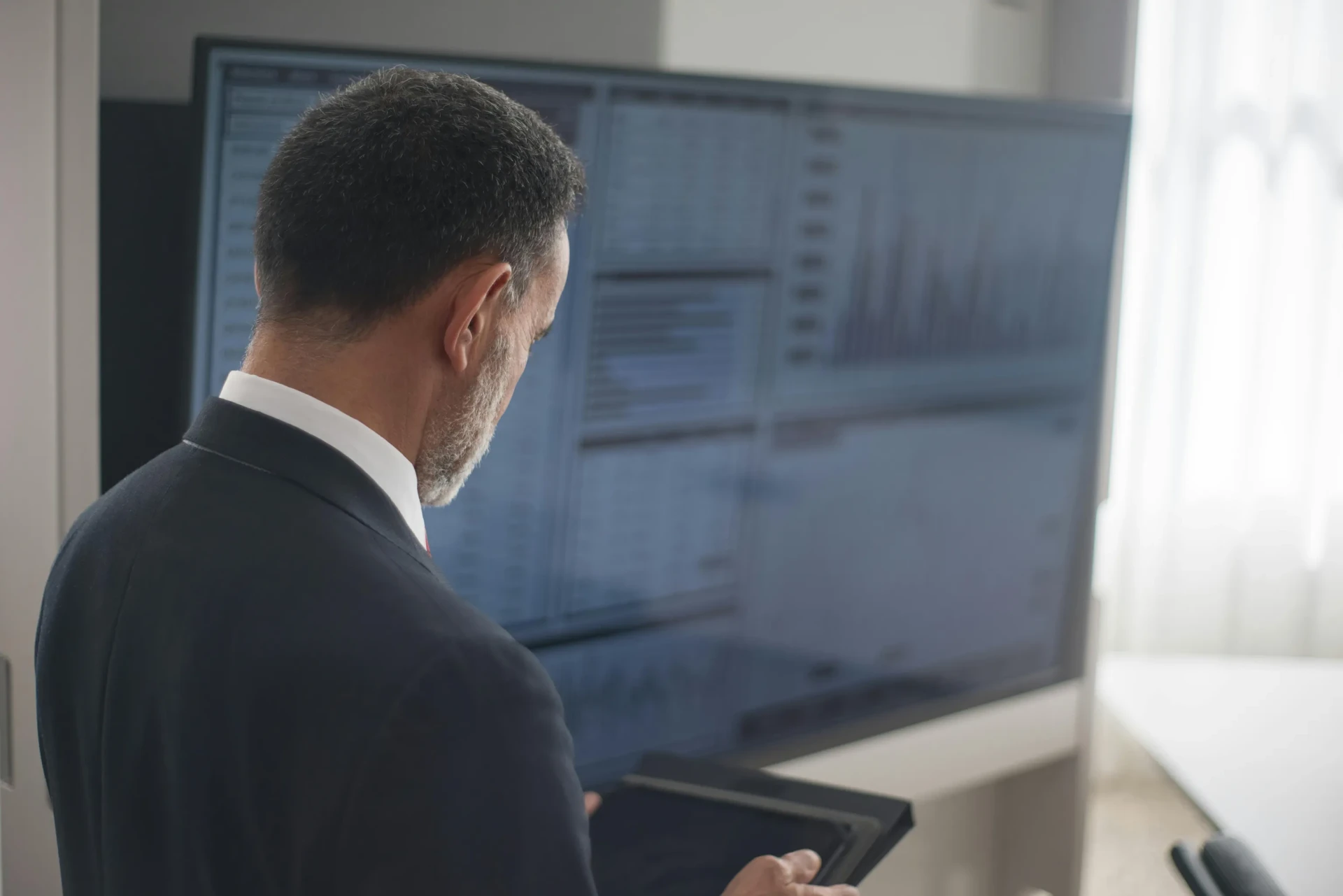 Executive office space with wall-mounted KPI dashboards