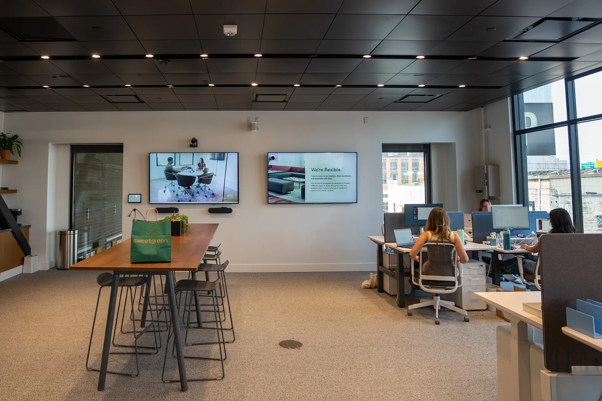 Conference room with digital display showing meeting schedule and room availability